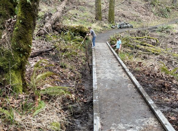 Nathaniel and Oliver putting the finishing touches on the drainage.