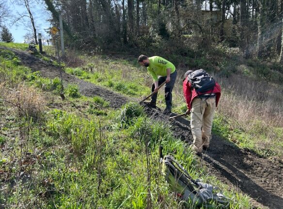 Matt and Joe spreading gravel.