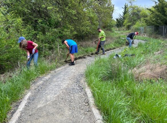 Teresa, Sony, Matt, and Dan ditch digging.