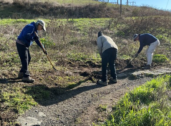 Janet, Dave, and Jim uncovering the cobble armored corner.